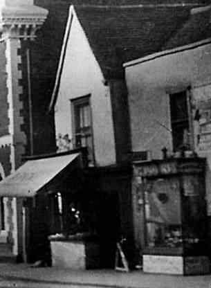 Exterior of the building when it was a butchers, looking west.
